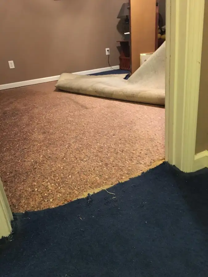 Carpet pad removal revealing water damage during Water Mitigation Services in Mount Hood Villages